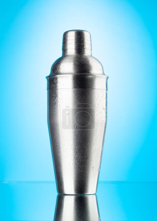 Photo for Cocktail shaker on blue background - Royalty Free Image