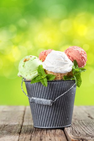 Photo for Various ice cream in waffle cones. Strawberry, pistachio and vanilla icecream. With copy space - Royalty Free Image
