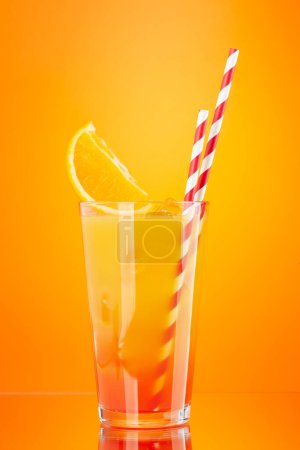 Photo for Tequila sunrise cocktail on orange background with copy space - Royalty Free Image
