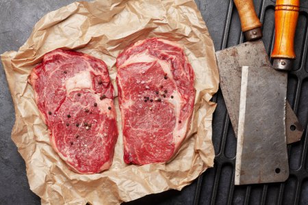 Photo for Two raw ribeye beef steaks. Top view flat lay - Royalty Free Image
