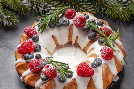 Photo for Christmas cake with raspberry, blueberry and rosemary - Royalty Free Image