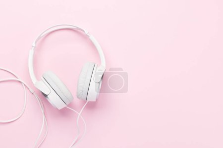 Photo for Headphones on pink background. Flat lay with copy space - Royalty Free Image