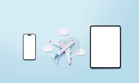 Travel and online booking concept. Smartphone, tablet and airplane on blue desk with copy space