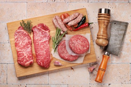 Photo for Various raw meat. Steaks, sausages, burgers and spices. Flat lay - Royalty Free Image