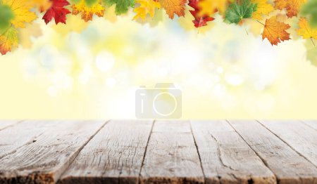 Téléchargez les photos : Empty wooden table with sunny autumn backdrop on background. With copy space for your product - en image libre de droit