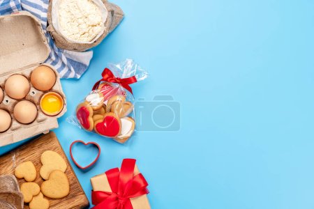 Photo for Cooking gingerbread heart cookies for Valentines day holiday. Flat lay with space for your greetings - Royalty Free Image