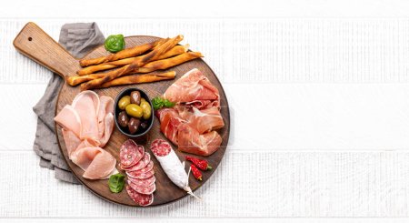 Photo for Antipasto board with various meat and snacks. Flat lay with copy space - Royalty Free Image