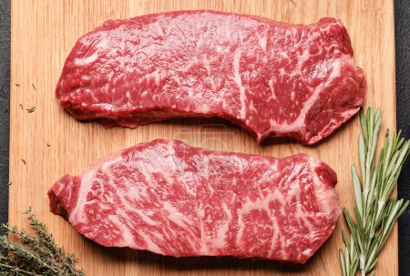 Photo for Prime marbled beef steaks. Raw striploin steak. Flat lay - Royalty Free Image