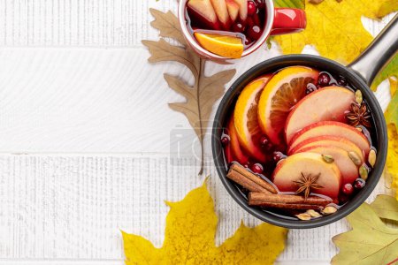 Photo for Hot mulled wine with fruits and spices. Autumn cocktail. Flat lay with copy space - Royalty Free Image