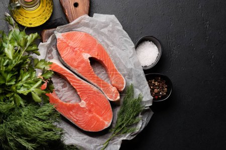 Photo for Fresh salmon steak. Two fish steaks and spices. Flat lay with copy space - Royalty Free Image