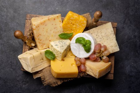 Foto de Various cheese in wooden box. Flat lay - Imagen libre de derechos