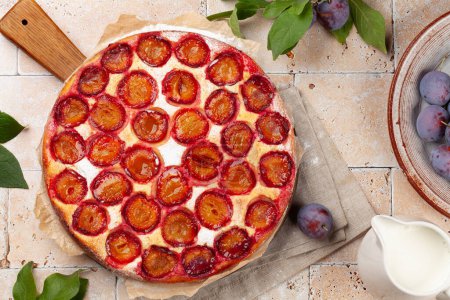 Photo for Homemade plum pie. Fruit tart with seasonal fruits. Flat lay - Royalty Free Image
