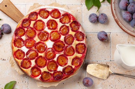 Photo for Homemade plum pie. Fruit tart with seasonal fruits. Flat lay - Royalty Free Image
