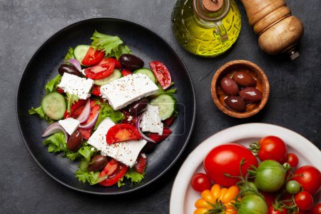 Photo for Greek salad with fresh vegetables and feta cheese. Flat lay - Royalty Free Image