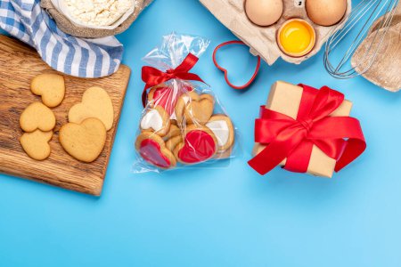 Photo for Cooking gingerbread heart cookies for Valentines day holiday. Flat lay with space for your greetings - Royalty Free Image