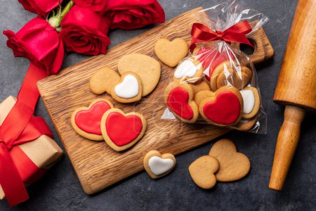 Photo for Valentines day card with heart shaped cookies, rose flowers and gift box. Flat lay - Royalty Free Image