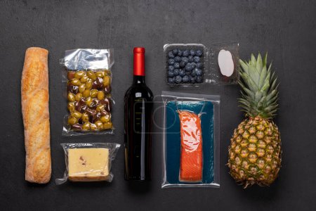 Photo for Wine bottle and various food. Flat lay - Royalty Free Image