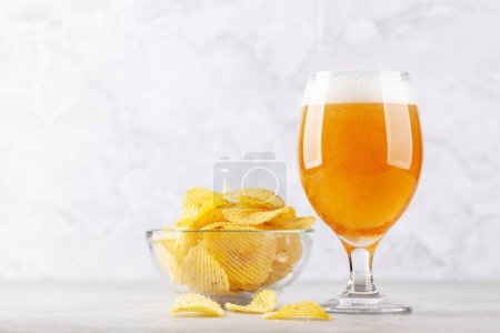 Photo for Beer glass and potato chips. With copy space - Royalty Free Image