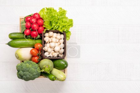 Photo for Wooden boxes full of healthy vegetables food. Flat lay with copy space - Royalty Free Image
