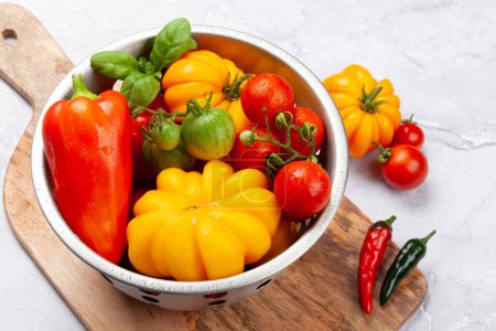 Photo for Various colorful garden tomatoes and bell peppers. Fresh vegetables and spices - Royalty Free Image