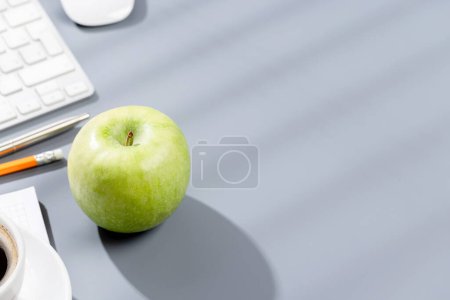 Photo for Top view business office desk with apple, computer, supplies and coffee. Workspace with copy space - Royalty Free Image