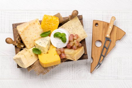 Photo for Various cheese in wooden box. Flat lay - Royalty Free Image