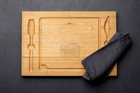 Photo for Wooden cutting board and kitchen towel. Flat lay with copy space - Royalty Free Image