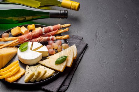 Photo for Antipasto board with various cheese and snacks. With copy space - Royalty Free Image