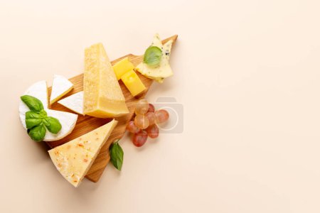 Photo for Various cheese on board. Flat lay with copy space - Royalty Free Image