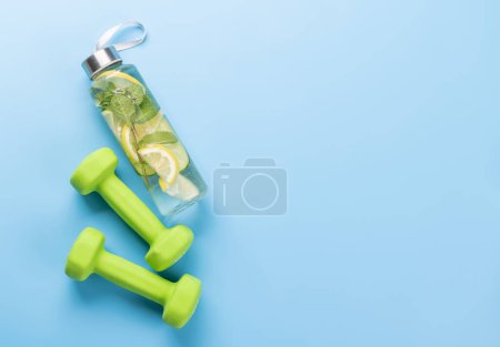 Photo for Healthy lifestyle, sport and diet concept. Dumbbells and healthy drink. With space for your text - Royalty Free Image