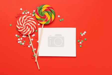 Photo for Candy sweets and blank greeting card for your greetings. Flat lay - Royalty Free Image