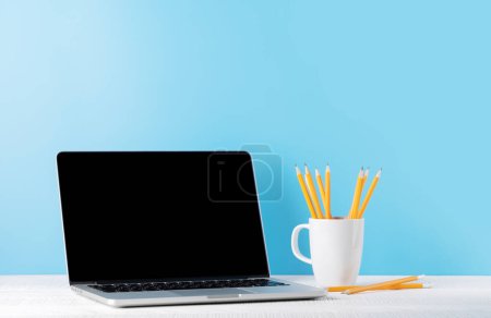 Photo for Laptop with blank screen for your message, app or web. Computer with white display - Royalty Free Image