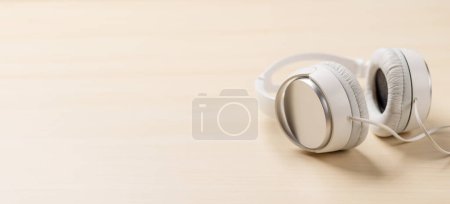 Photo for Headphones on a desk with empty space - Royalty Free Image