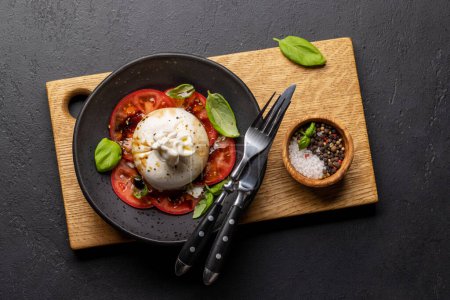 Photo for Antipasto with burrata cheese, tomatoes and basil. Italian cuisine. Flat lay - Royalty Free Image