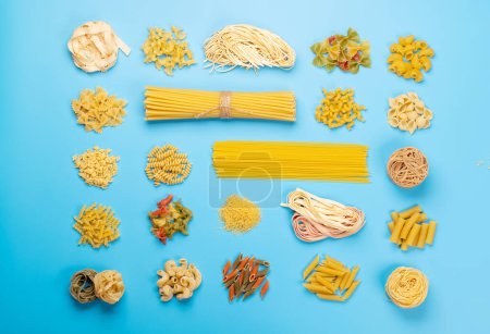 Various uncooked pasta and spaghetti. Flat lay