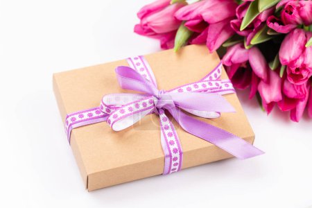 Photo for Pink tulip flowers bouquet and gift box - Royalty Free Image