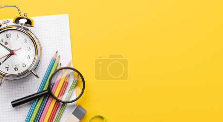 Foto de School supplies and stationery on yellow background. Flat lay with blank space - Imagen libre de derechos