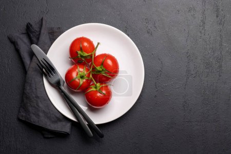 Photo for Fresh ripe garden tomatoes on plate. Flat lay with space for your text - Royalty Free Image
