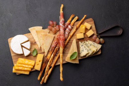 Photo for Antipasto board with various cheese and snacks. Flat lay - Royalty Free Image