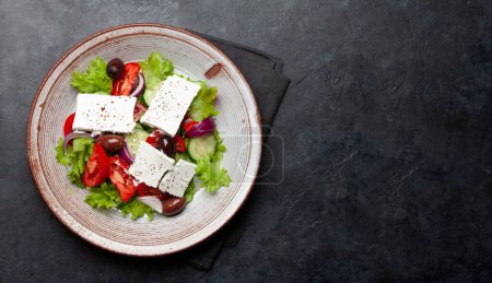 Photo for Greek salad with fresh vegetables and feta cheese. Flat lay with copy space - Royalty Free Image