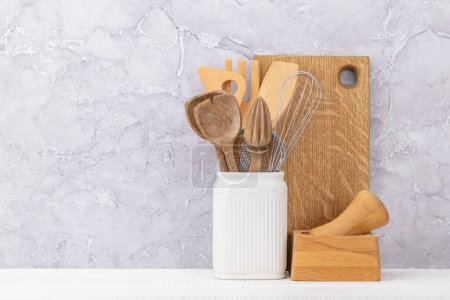Téléchargez les photos : Kitchen utensils on wooden table. Front view with copy space - en image libre de droit