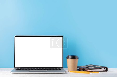 Photo for Laptop with blank screen for your message, app or web and coffee cup. Computer with white display - Royalty Free Image
