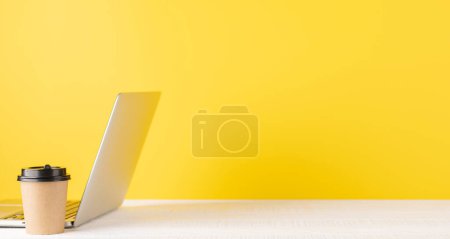 Photo for Laptop and coffee cup. Computer on desk with blank space for your text - Royalty Free Image