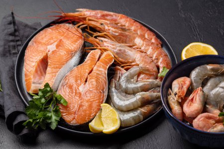 Photo for Fresh seafood such as shrimp, langoustines and trout steaks - Royalty Free Image