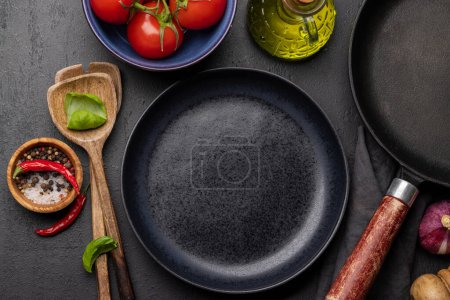 Photo for Top-down view of an empty plate mockup with food and kitchen utensils, perfect for showcasing a meal - Royalty Free Image