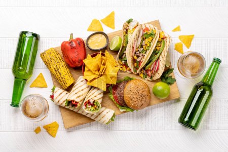 Photo for Mexican food featuring tacos, burritos, nachos, burgers and more. Flat lay - Royalty Free Image