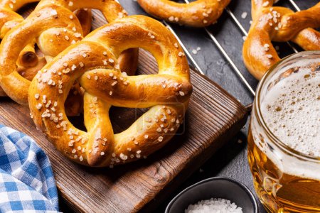 Photo for Freshly baked homemade pretzels and draft beer - Royalty Free Image