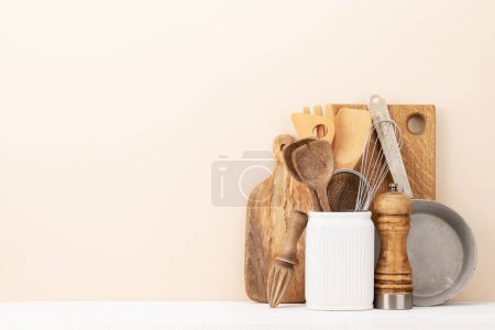 Foto de Kitchen utensils on wooden table. Front view with copy space - Imagen libre de derechos