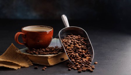 Rich coffee in a cup with aromatic roasted beans, a perfect morning brew. With copy space