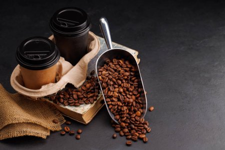 Photo for Rich takeout coffee in a paper cup and aromatic roasted beans, a perfect morning brew - Royalty Free Image